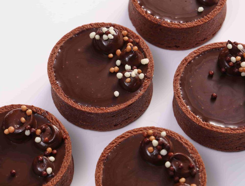 Chocolate tartlets on a white background